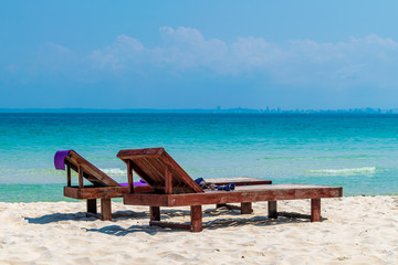 A couple of beach chairs on the beach at the Coconut Beach, Koh Rong, Cambodia
