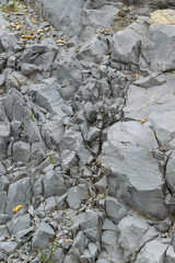 Detail of natural rough stone, rippled rock background