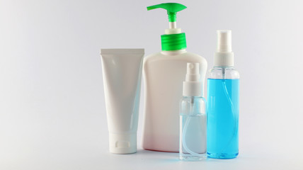 Medical mask, surgical mask, alcohol of bottle, white alcohol, blue alcohol, Liquid soap, white bottle, green pumps, white background, coronaviruses, Covid-19