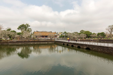 Fototapeta na wymiar Wonderful view of the “ Meridian Gate Hue “ to the Imperial City with the Purple Forbidden City within the Citadel in Hue, Vietnam. Imperial Royal Palace of Nguyen dynasty in Hue. Hue is a popular 