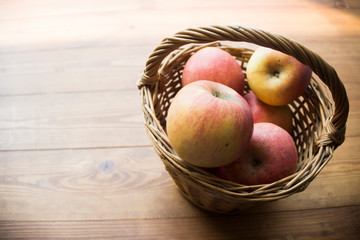 ripe apples on a wooden background
