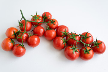 Healthy food ingredient - raw tomatoes on white background, vibrant colours, vitamin food, space for text