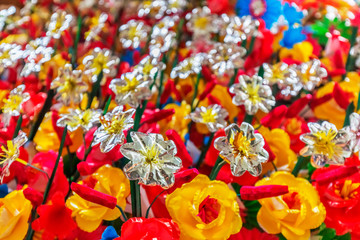 Fototapeta na wymiar Flowers made of colored paper, in the Thanh Tien traditional village, Hue, Vietnam