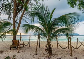 Sok San Beach, Koh Rong, Cambodia- Feb, 2020 : beach chairs and umbrellas from the Sok San Beach, Koh Rong, Cambodia	
