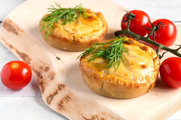  meat pie on wooden table close-up with copy space