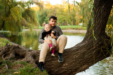 little girl celebrates her birthday 1 year in nature with her brother