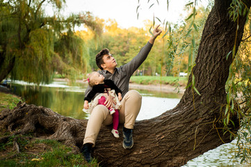 little girl celebrates her birthday 1 year in nature with her brother