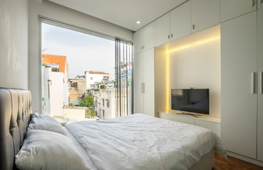 Bright and cozy modern bedroom at Ho Chi Minh city, Vietnam