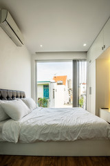 Bright and cozy modern bedroom at Ho Chi Minh city, Vietnam