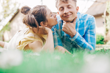 happy young couple. Couple in love. Grass background. Family photo. Sensual. Man and woman. Nature background. 