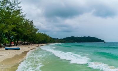 Fototapeta premium Long Set Beach, Koh Rong, Cambodia- Feb, 2020 : a view of some boats on the beach at the Long Set Beach, Koh Rong, Cambodia