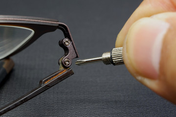 Repairing eyeglass activity with black background
