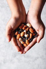 Handful of Nuts and Dry Fruits - Vertical