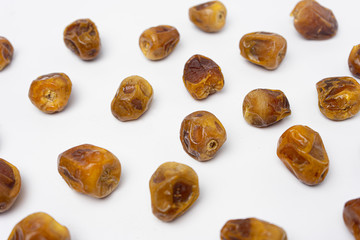 row of dates palm fruit on a white background, Infinite depth of field, retouched