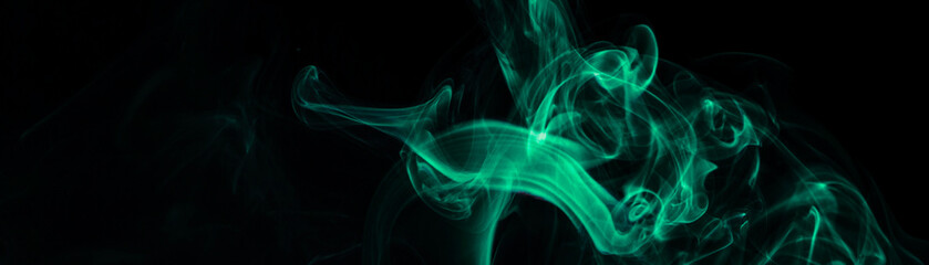 Obraz premium Green smoke on black background