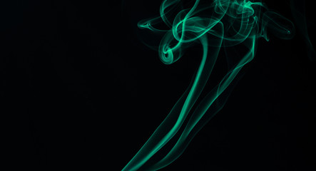 Green smoke on black background