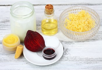 Homemade lip balm made from beeswax and  olive with coconut oil. Red beet is used due to attractive color.  Alternative cosmetic product without harmful ingredients.