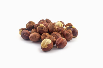 A few hazelnuts isolated on a white background. Well suited for baking or in healthy muesli.