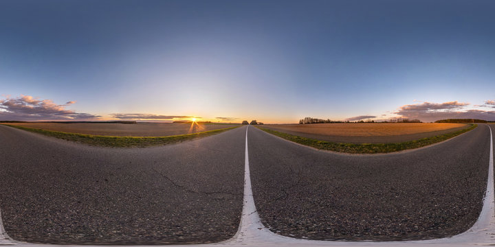Full spherical seamless hdri panorama 360 degrees angle view on no traffic asphalt road among fields in evening  before sunset with clear sky. 360 panorama in equirectangular projection, VR AR content