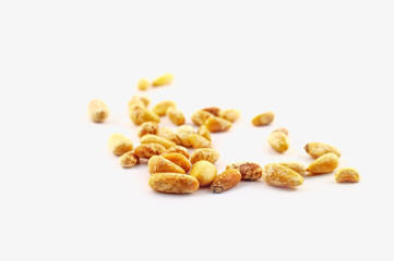Loose pine nuts, without pine cones, lie isolated on a white background