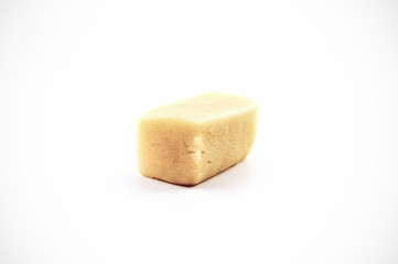 Raw Marzipan block isolated on white background