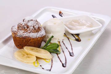 Tasty hot muffin with ice cream