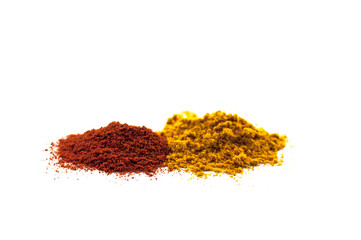 Mix of different powders like paprica and curry isolated on white background