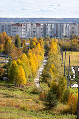 Sunny autumn cityscape of village and town