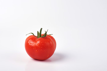 Tomato isolate. Tomato on a white background. Tomatoes top view, side View. With the path cut off.