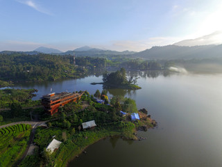 Fototapeta premium Bandung Indonesia June, 4 2020: Beautiful Lake Patenggang with green tea field in ciwidey Indonesia