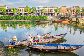 Fototapeta na wymiar Aerial view of Hoi An ancient town, UNESCO world heritage, at Quang Nam province. Vietnam. Hoi An is one of the most popular destinations in Vietnam. Boat on Hoai river