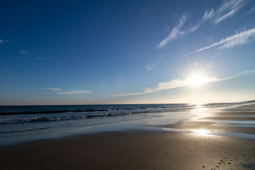 Fototapeta na wymiar deserted beach at sunset