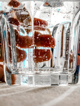 Fingers on a glass of water