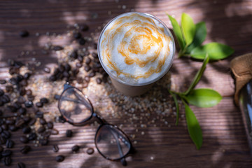 top view of a cup of coffee with cream topping, natural light