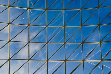 Transparent ceiling. Glass ceiling of the room close-up. Glass over your head. sky panorama