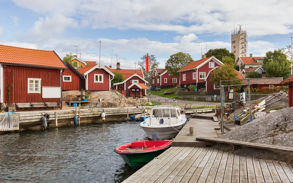 Typical fishing village with red cottages in Stockholm archipelago.