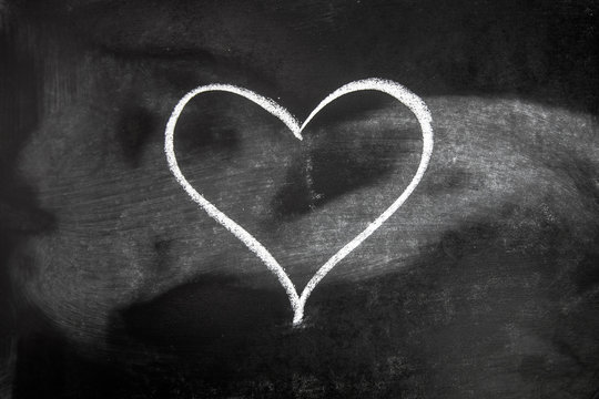 Close-up Of Heart Shape On Blackboard