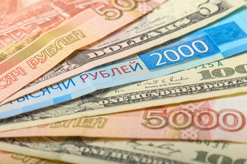 Cash banknotes background. The background of the American and Russian money banknotes. Dollars and rubles background.