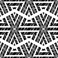 Hexagons. Design with manual hatching. Ethnic boho ornament. Seamless background. Tribal motif. Vector illustration for web design or print.