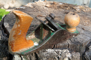 Old wood planer on wooden boards