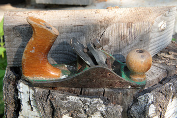 Old wood planer on wooden boards