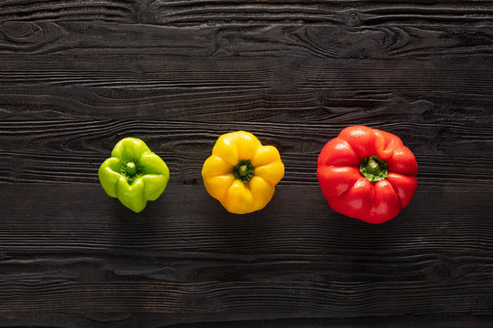 fresh pepers on wooden table