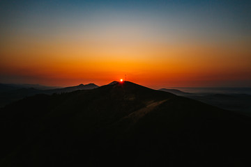 Obraz premium Rana is a significant three-peak mountain 457m. in the western part of Ceske stredohori. The Rana National Nature Reserve is situated on the south-western hill of the trike, is the center of paraglide