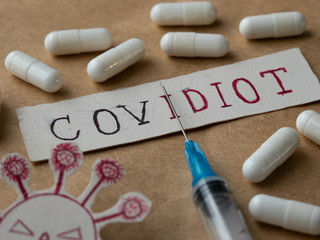 Covidiot Sticker, Covidiot Handwritten Text Coronavirus syringe and tablets
