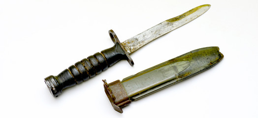 old bayonet on yellow white background isolated