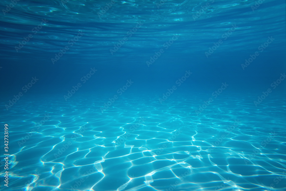 Wall mural underwater empty swimming pool background with copy space