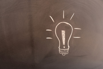 Blackboard with a light bulb