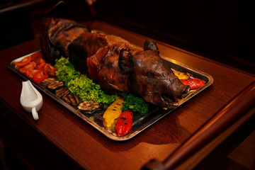 young roasted piggy pig being served at the celebration. © ZaStock