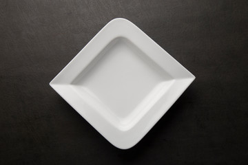 White pasta plate on a grey background