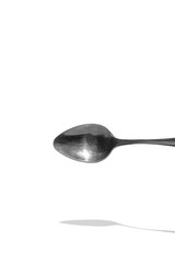 teaspoon top view with reflection isolated on white background